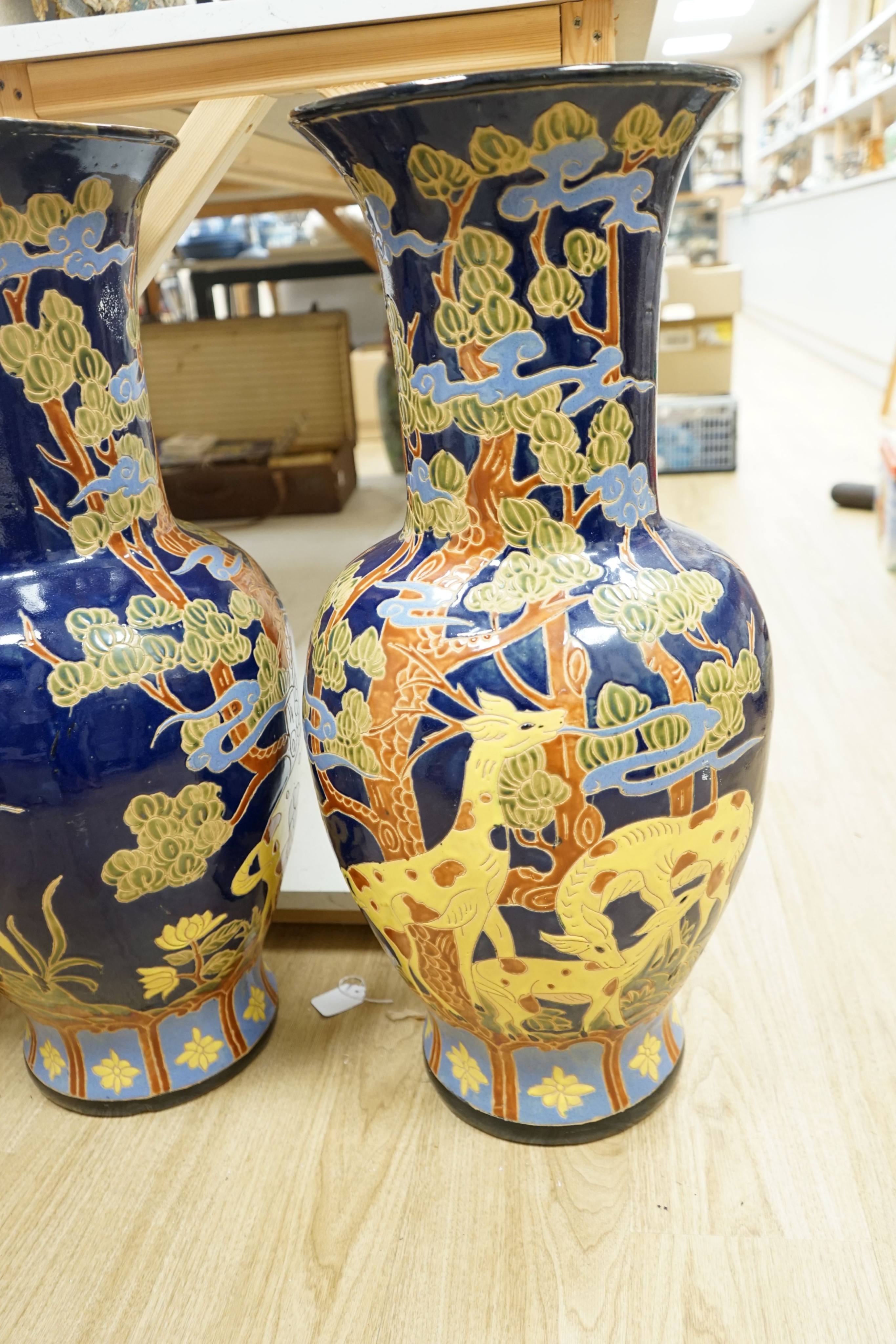 A pair of large Chinese polychrome pottery baluster vases, 82 cm